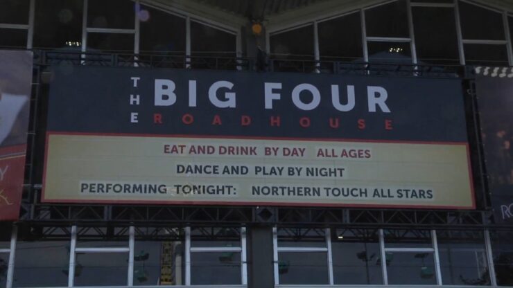 The Big Four Roadhouse sign at Calgary Stampede announces a live music performance