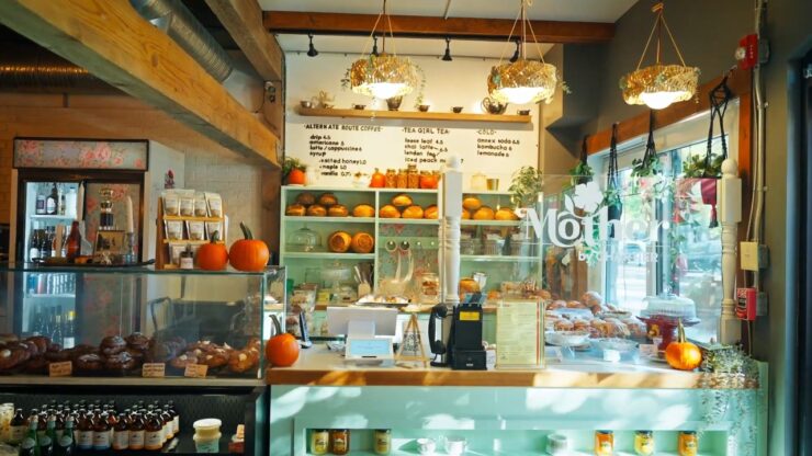Interior of a small-town Alberta café with baked goods and a cozy dining area