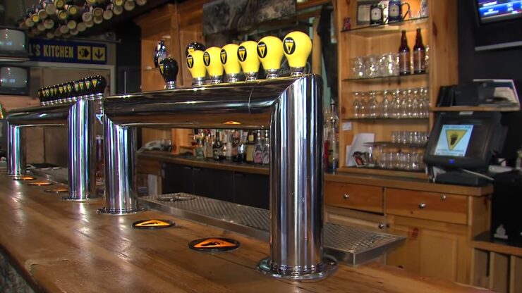 Beer taps line the bar inside Grizzly Paw Pub in Canmore