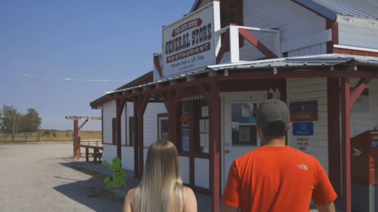 People walk toward the Twin Butte Country General Store & Restaurant in rural Alberta