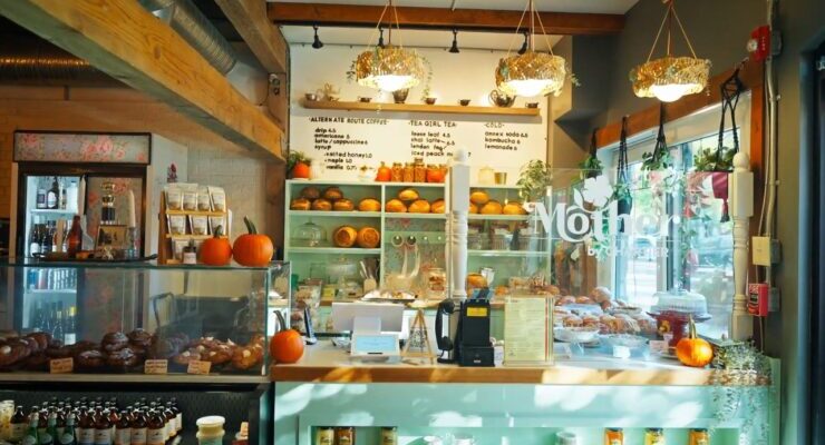 Interior of a small-town Alberta café with baked goods and a cozy dining area